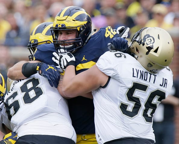 ANN ARBOR, MI - SEPTEMBER 17: Linebacker Ben Gedeon #42 of the Michigan Wolverines is blocked by offensive linebackers Gerrad Kough #68 of the Colorado Buffaloes and Tim Lynott #56 of the Colorado Buffaloes at Michigan Stadium on September 17, 2016 in Ann Arbor, Michigan. (Photo by Duane Burleson/Getty Images)