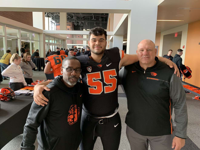 Andres Dewerk with Beavers coaches during a visit