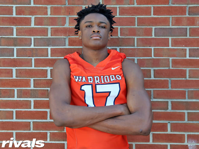 Georgia defensive end Joshua Josephs holds a Michigan Wolverines football recruiting offer. 