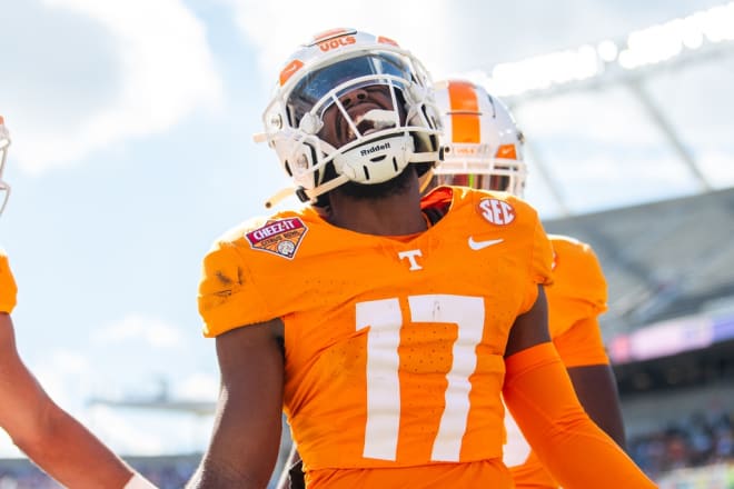 Jan 1, 2024; Orlando, FL, USA;Tennessee Volunteers defensive back Andre Turrentine (17) celebrates his interception against the Iowa Hawkeyes in the first quarter at Camping World Stadium.