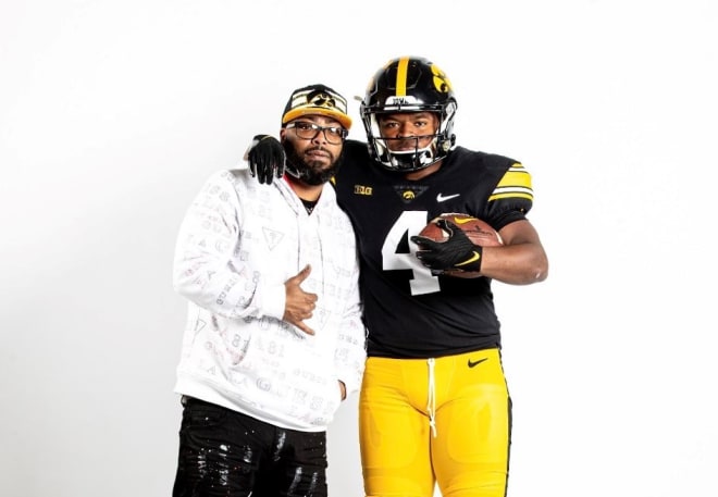 Running back Arnold Barnes III with his father on their official visit to Iowa this past weekend.