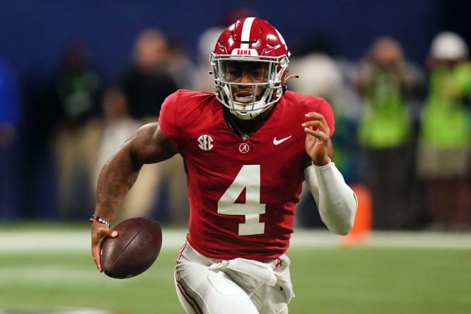 Alabama Crimson Tide quarterback Jalen Milroe (4) runs against the Georgia Bulldogs in the first quarter of the SEC Championship at Mercedes-Benz Stadium. Photo | John David Mercer-USA TODAY Sports