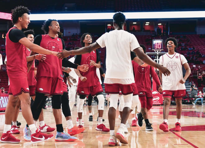 Teammates congratulate newcomer Devo Davis who won the Red-White pregame dunk contest.