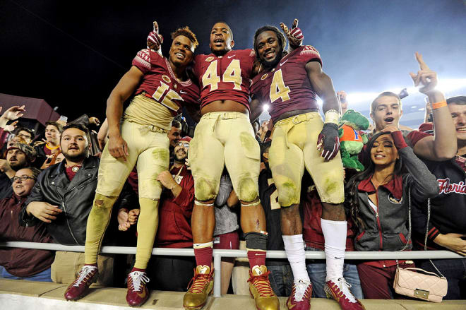 Francois, Walker and Cook celebrating the win with the fans.