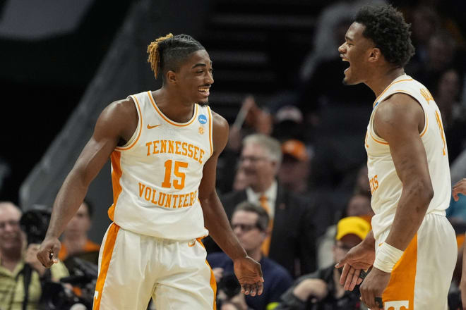 Tennessee guard Jahmai Mashack (15) and Tennessee forward Tobe Awaka (11) celebrate during the second half of a second-round college basketball game in the NCAA Tournament against Texas, Saturday, March 23, 2024, in Charlotte, N.C. (AP Photo/Mike Stewart)