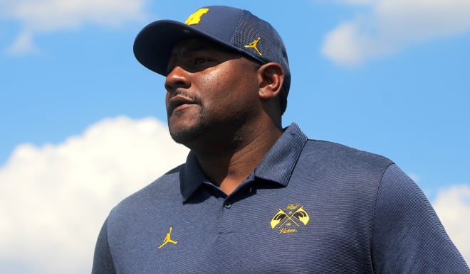 Michigan Wolverines football assistant Ron Bellamy is working hard on the recruiting trail. 