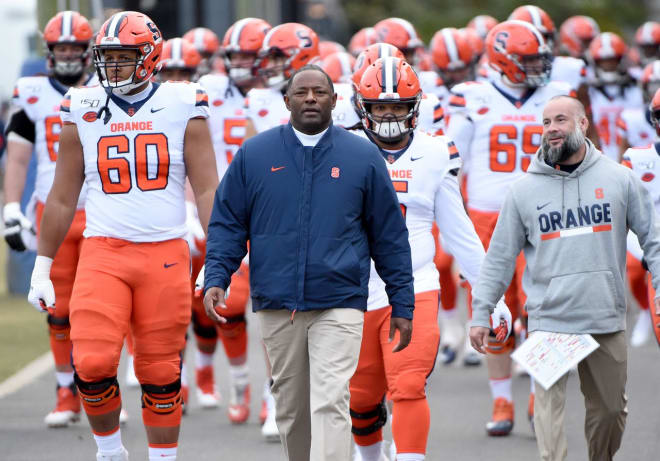 Syracuse head football coach Dino Babers with his team