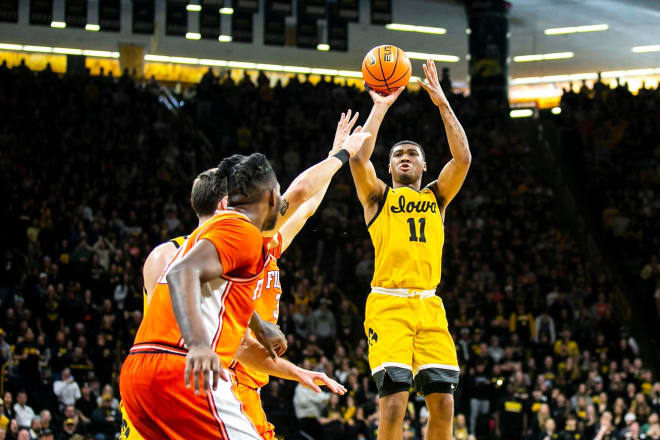 Tony Perkins rises for a jump shot in Iowa's win over Illinois. 