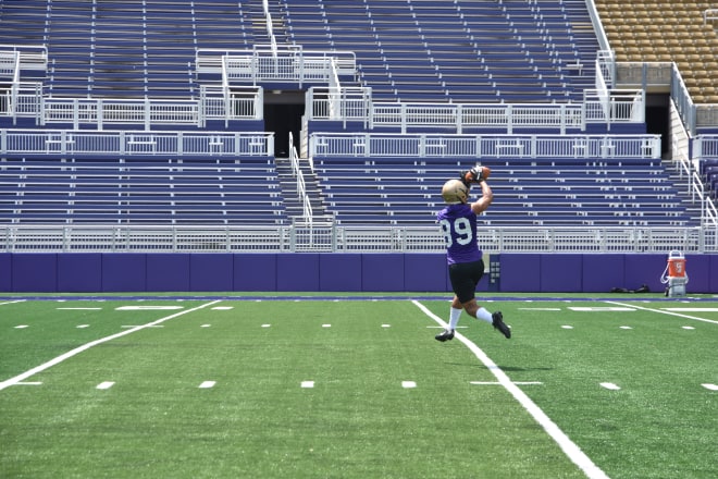James Madison wide receiver Jake Brown leaps to make a catch during Dukes practice this past Friday at Bridgeforth Stadium.