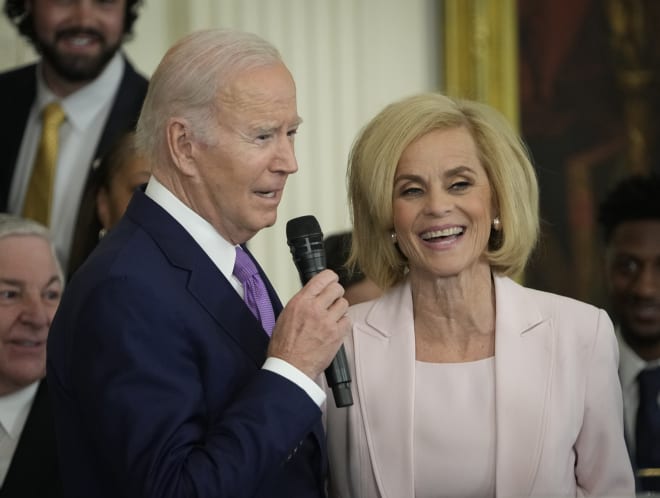 LSU women's basketball coach Kim Mulkey laughs as President Joe Biden welcomes the NCAA 2023 national champion Lady Tigers to the White House.