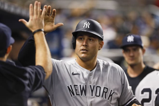 New York Yankees first baseman Anthony Rizzo (48) celebrates with teammates after scoring during the fifth inning against the Miami Marlins at loanDepot Park. Mandatory Credit: Sam Navarro-USA TODAY Sports