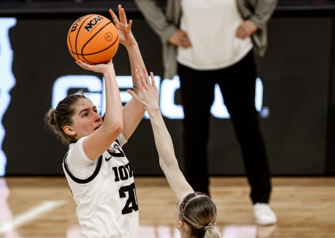Iowa guard Kate Martin shoots a fourth-quarter basket over UConn guard Paige Bueckers in Iowa's 71-69 win in the Final Four Friday night.