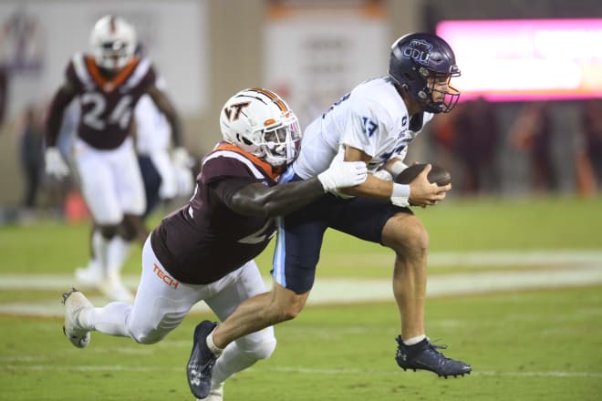 Sep 2, 2023; Blacksburg, Virginia, USA; Old Dominion Monarchs quarterback Grant Wilson (13) gets tackled by Virginia Tech Hokies defensive lineman Mario Kendricks (22) in the third quarter at Lane Stadium. Mandatory Credit: Lee Luther Jr.-USA TODAY Sports