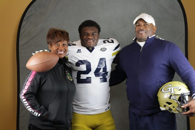 Malloy poses with his family on his GT official visit