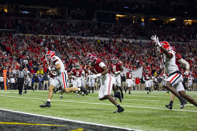 Bowers scores a TD in the national championship game win over Alabama.