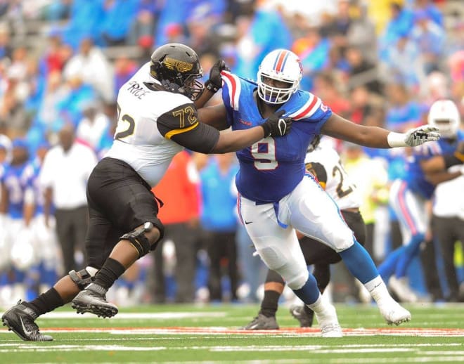 Vernon Butler fights off a block against Southern Miss in his final game in Joe Aillet Stadium.