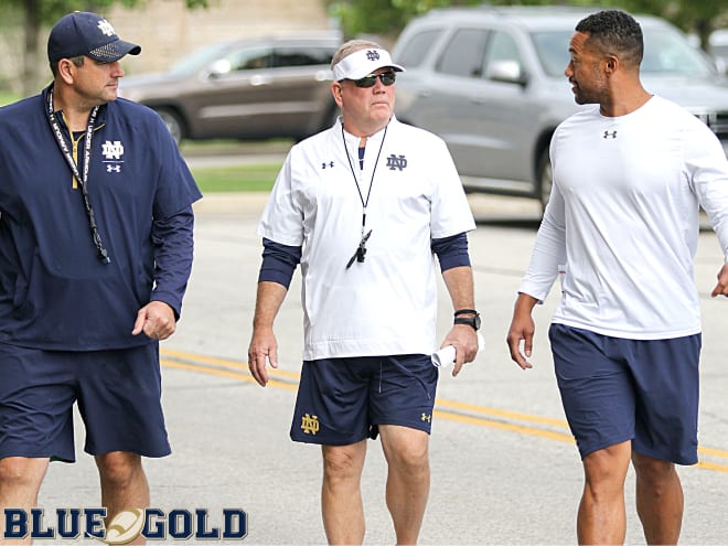 Notre Dame Fighting Irish football coaches Mike Elston, Brian Kelly and Marcus Freeman