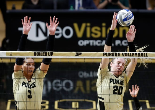 Purdue Boilermakers Megan Renner (3) and Purdue Boilermakers Hannah Clayton (20) defend a strike during the NCAA women s volleyball match against the Ball State Cardinals, Saturday, Sept. 17, 2022, at Holloway Gymnasium in West Lafayette, Ind.