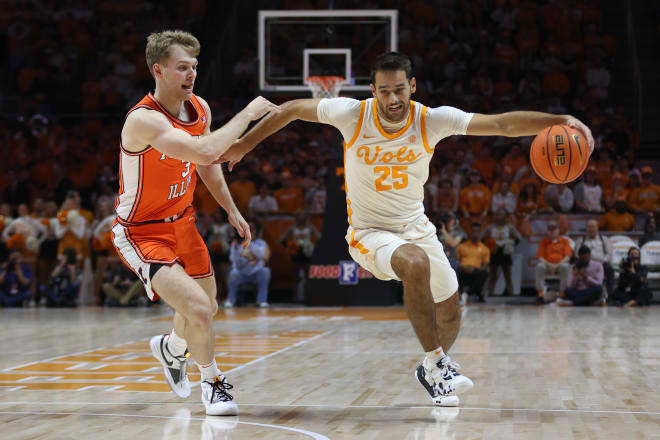 Dec 9, 2023; Knoxville, Tennessee, USA; Tennessee Volunteers guard Santiago Vescovi (25) moves the ball against Illinois Fighting Illini forward Marcus Domask (3) during the first half at Food City Center at Thompson-Boling Arena.