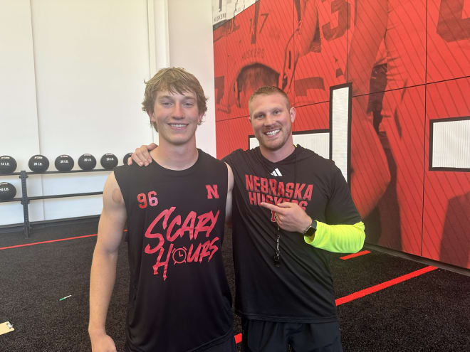 2026 Elkhorn (Neb.) North LB Jase Reynolds and Nebraska LBs coach Rob Dvoracek.