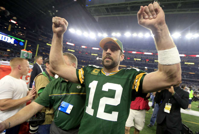 Green Bay quarterback Aaron Rodgers celebrates following the Packers' win over Dallas Sunday in the NFC Divisional Playoffs. 