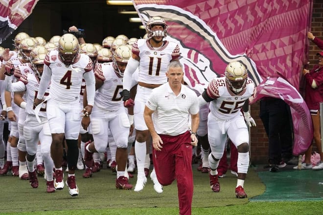 Mike Norvell leads the FSU football team out onto the field this past Saturday at North Carolina.