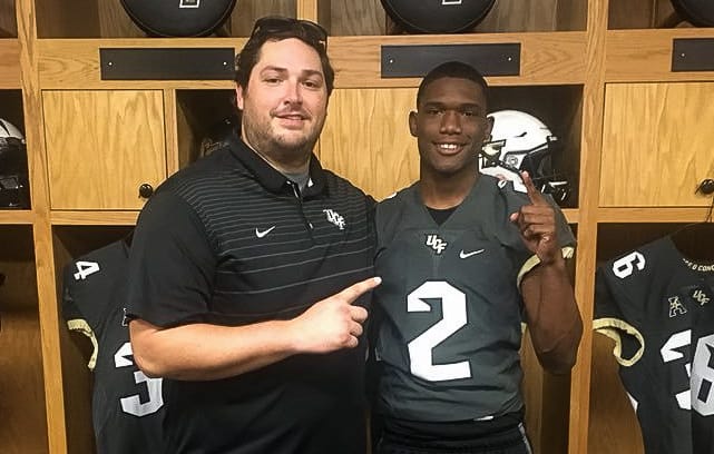 Damarius Good with UCF quarterbacks coach Jeff Lebby during a February unofficial visit. 