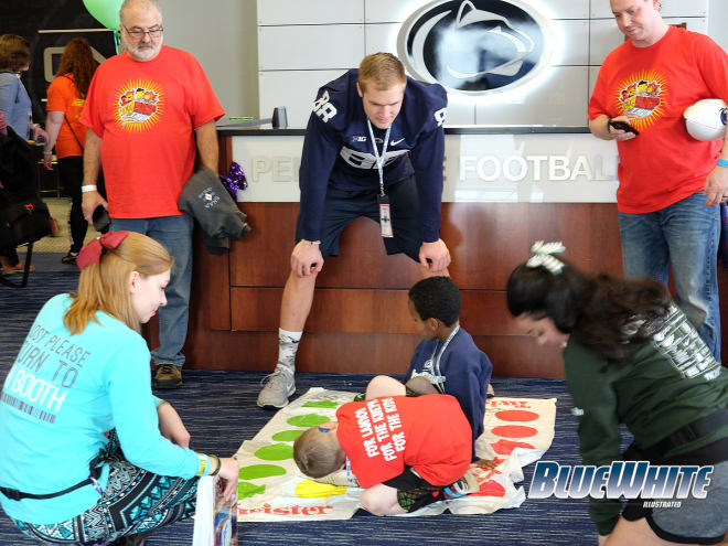 Tight end Mike Gesicki moderates a game of Twister in the Lasch upstairs lobby.