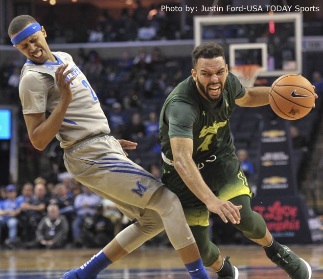 USF Bulls forward Payton Banks (4) goes to the basket against Memphis Tigers forward Jimario Rivers (2) during the first half at FedExForum. 