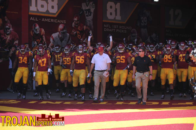 Clay Helton leads USC out of the tunnel Saturday before the Trojans' 38-35 loss to Arizona State.