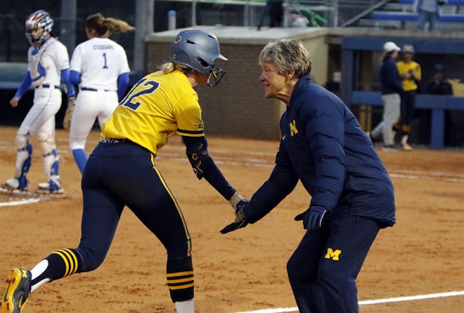 Michigan coach Carol Hutchins, the all-time wins leader in NCAA softball, congratulated the Wolverines' Lauren Esman after her solo home run in the sixth inning of Michigan's 8-0 win over Kentucky.