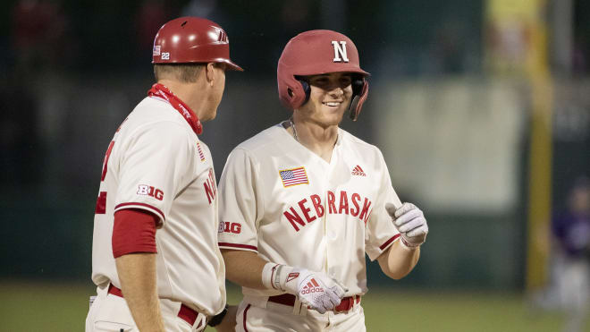 Luke Sartori smiles after a base hit.