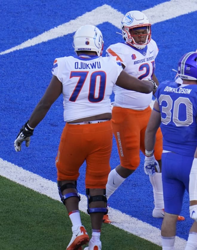Boise State running back Andrew Van Buren, rear, is congratulated by offensive lineman John Ojukwu after a touchdown during the first half of the team's NCAA college football game against Air Force on Saturday Oct. 31, 2020, at Air Force Academy, Colo. (AP Photo/David Zalubowski)