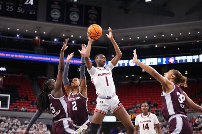 Celia Sumbane (1) goes up with the ball against Texas A&M.
