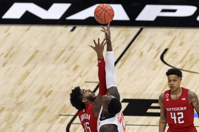 Mar 12, 2021; Indianapolis, Indiana, USA; Rutgers Scarlet Knights center Myles Johnson (15) battles for the tipoff against Illinois Fighting Illini center Kofi Cockburn (21) in the first half at Lucas Oil Stadium. 