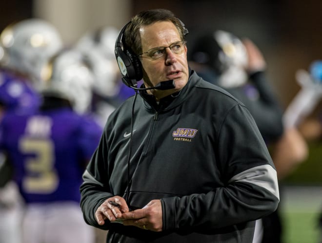 James Madison coach Curt Cignetti looks back at his bench from the field during the Dukes' win over Weber State in the semifinals of the FCS playoffs last month at Bridgeforth Stadium.