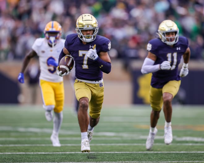 Notre Dame sophomore cornerback Jaden Mickey (7) races to the end zone with a pick-6 Saturday against Pitt during his first start this season.