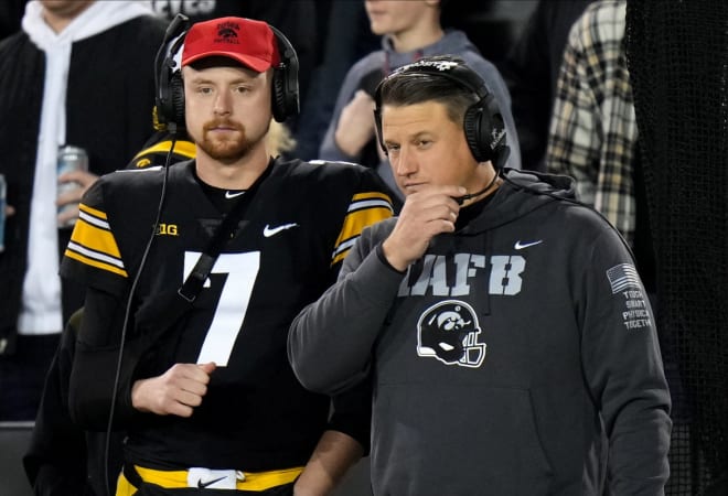 Brian Ferentz and Spencer Petras confer during Iowa's 24-17 loss to Nebraska in November 2022.