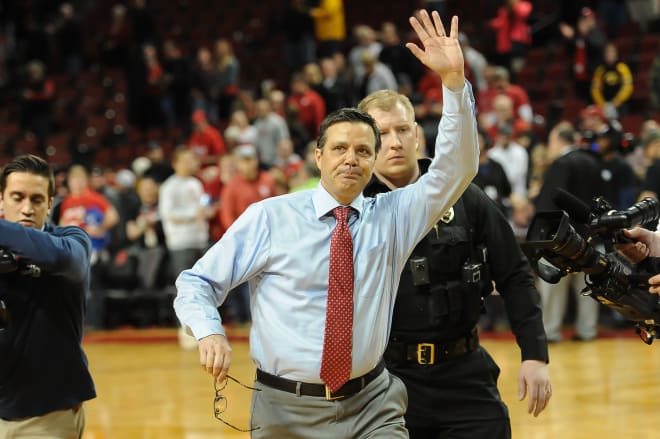 Head coach Tim Miles waves to the fans after Nebraska's 93-91 overtime win over Iowa to close out the regular season.