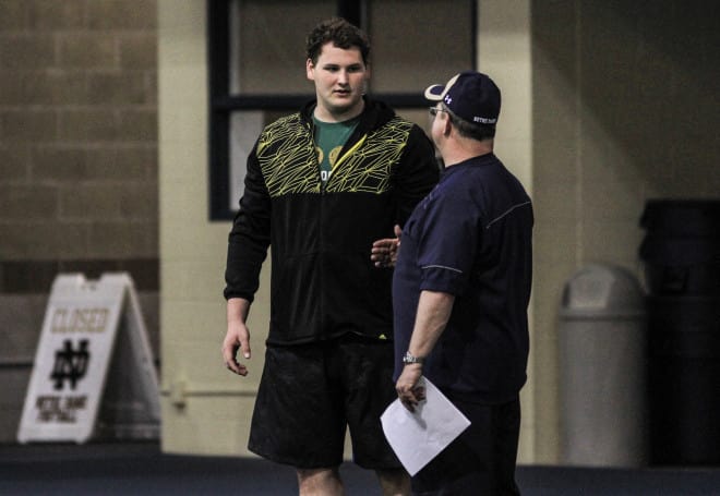 Tommy Kraemer, shown with offensive line coach Harry Hiestand, is Notre Dame's most recent USA Today All-American.
