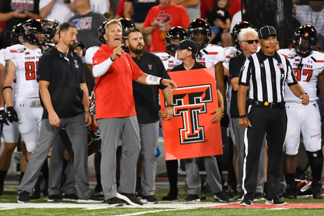 Texas Tech defensive coordinator calls the play from the sideline against the Arizona Wildcats.