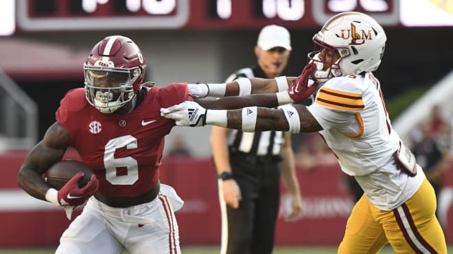 Alabama Crimson Tide running back Trey Sanders (6) is tackled by UL Monroe Warhawks defensive back Simion Hines (15) at Bryant-Denny Stadium. Sanders was called for an offensive face mask penalty. Photo | Gary Cosby Jr.-USA TODAY Sports