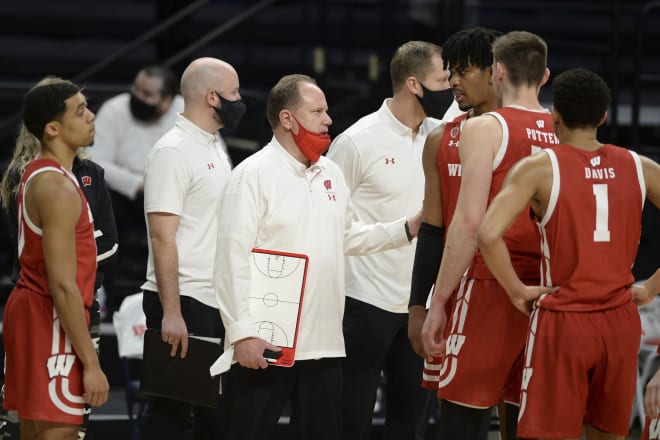 Wisconsin coach Greg Gard talks to Aleem Ford (third from right) in a timeout during Wisconsin's 81-71 loss at Penn State