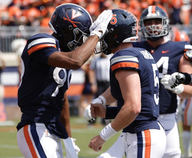 Brennan Armstrong (right) had a huge day against the Illini in his best game as a Wahoos.