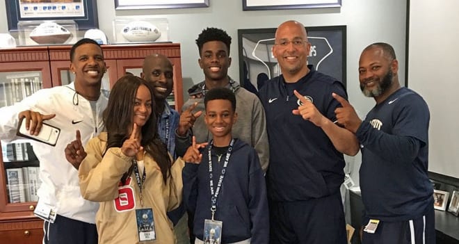 DB Myles Bell and his family pose with James Franklin, Terry Smith and Justin King.