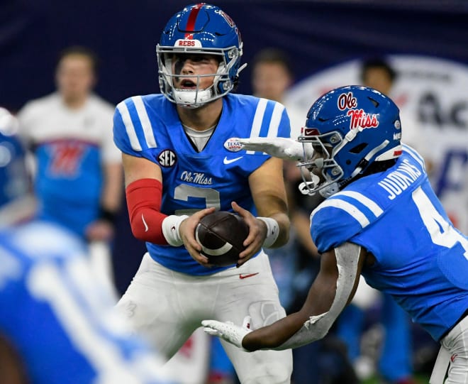 Ole Miss quarterback Jaxson Dart (2), left, prepares to hand off the ball to Mississippi's running back Quinshon Judkins (4) in the Texas Bowl game against Texas Tech, Wednesday, Dec. 28, 2022, at NRG Stadium in Houston.