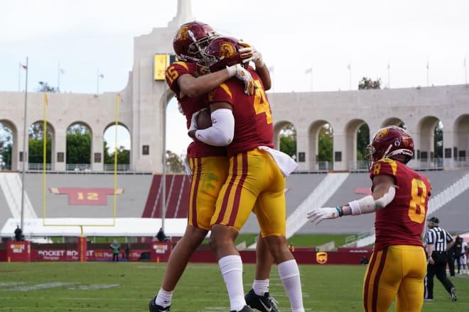 USC wide receivers Drake London (15) and Bru McCoy (4) celebrate in the end zone Saturday.