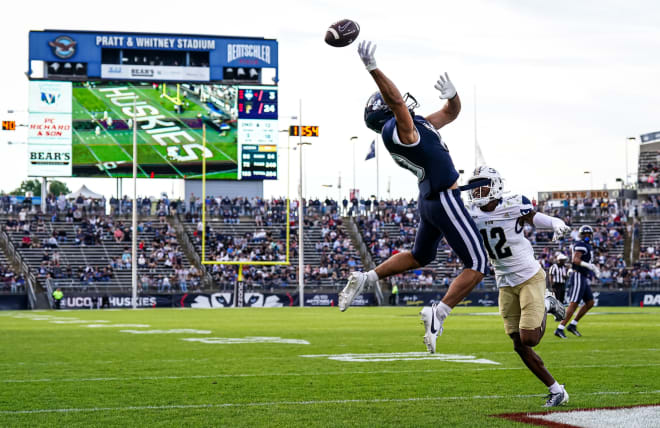 UConn receiver Brett Buckman, left, tries to bring in a pass in the end zone against FIU last weekend. 