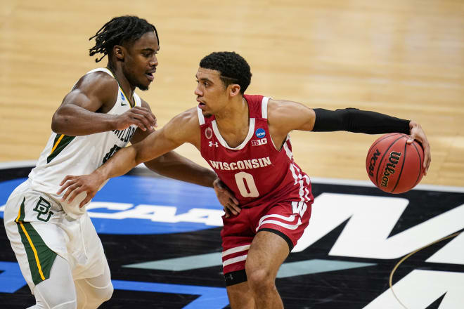 Wisconsin guard D'Mitrik Trice (0) drives on Baylor guard Davion Mitchell (45) in the first half. Trice had a team-high 12 points but needed 17 attempts to get it.