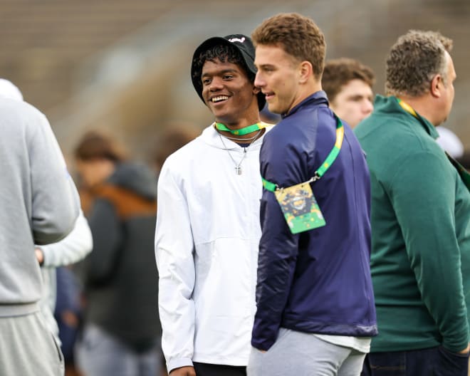 2024 recruits Cam Williams (left) and CJ Carr share a moment on the sidelines at the ND-Clemson game on Nov. 5.